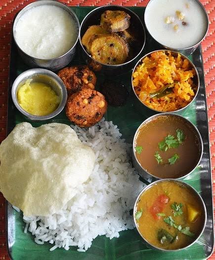 Andhra banana leaf meal with rice, sambar, rasam and vada